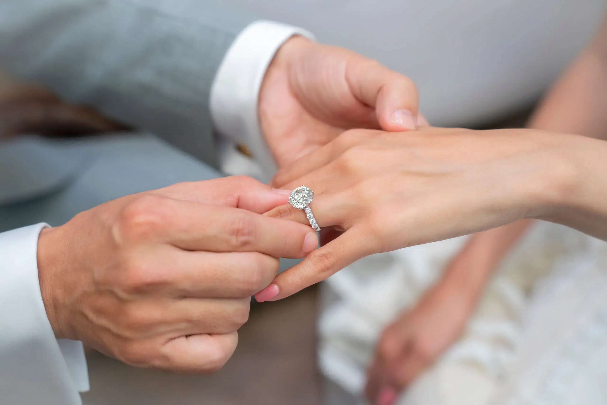 man holding woman's hand