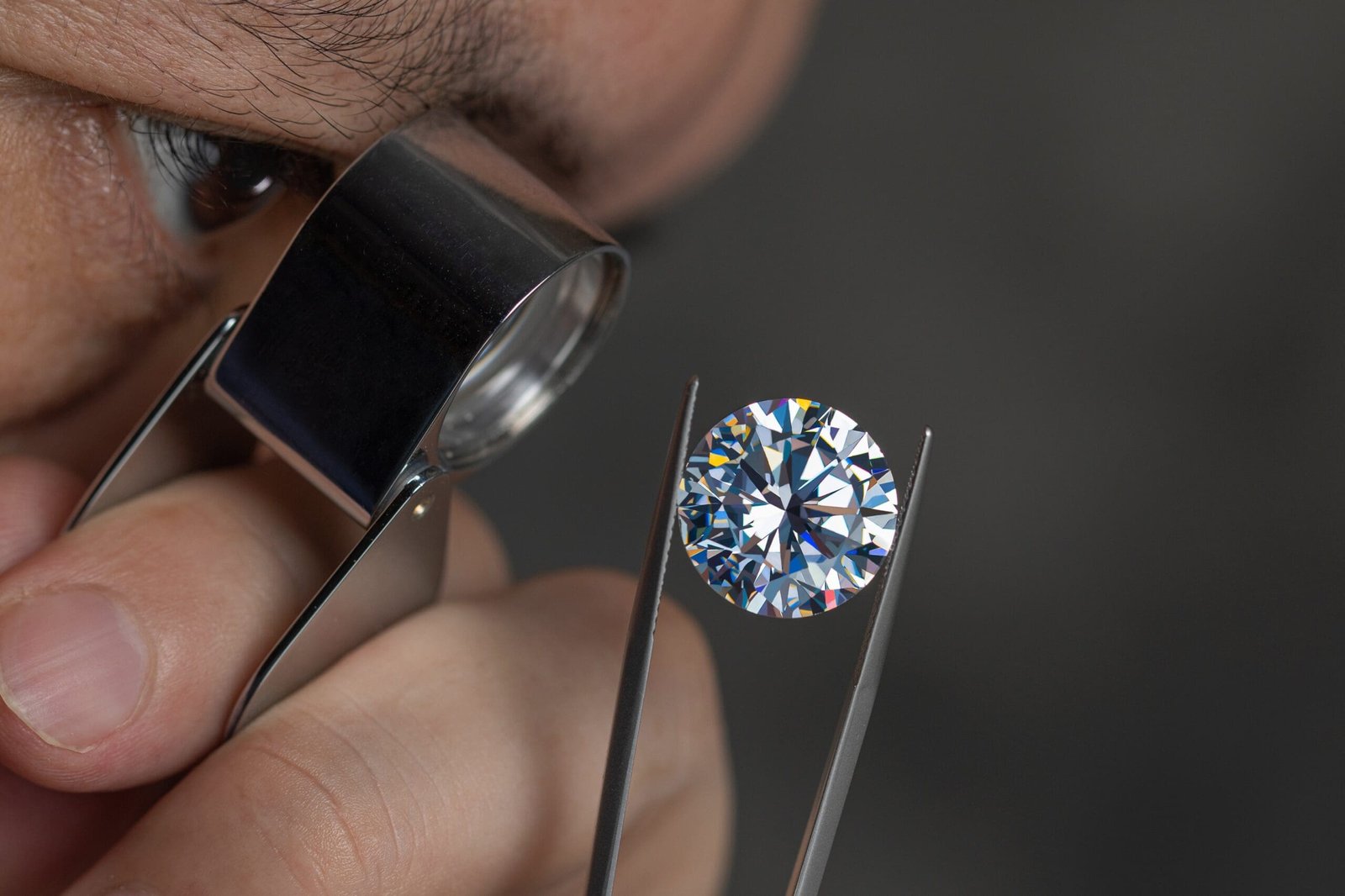 man inspecting diamond